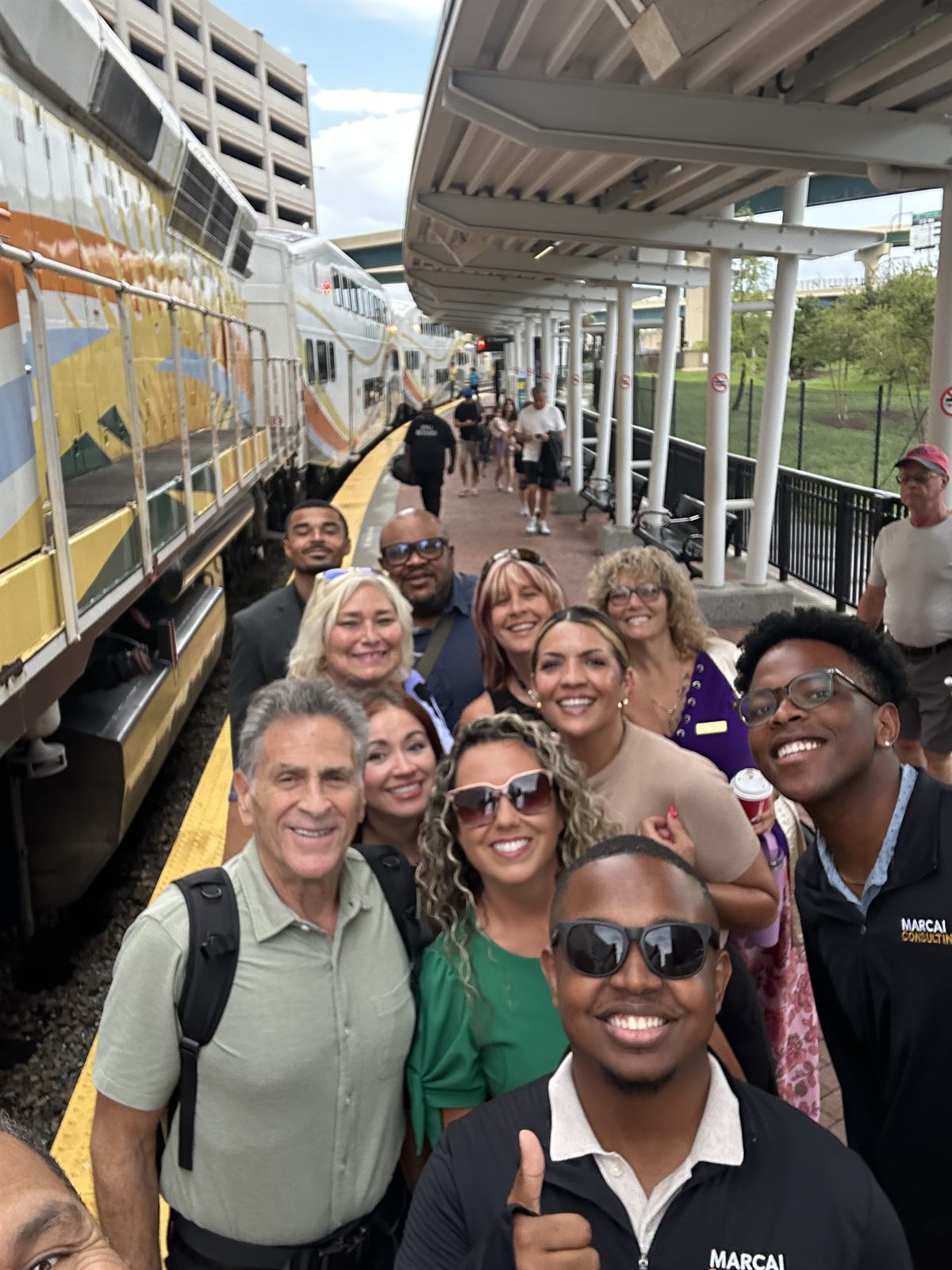 Marcai team with community members at a SunRail station gathering.