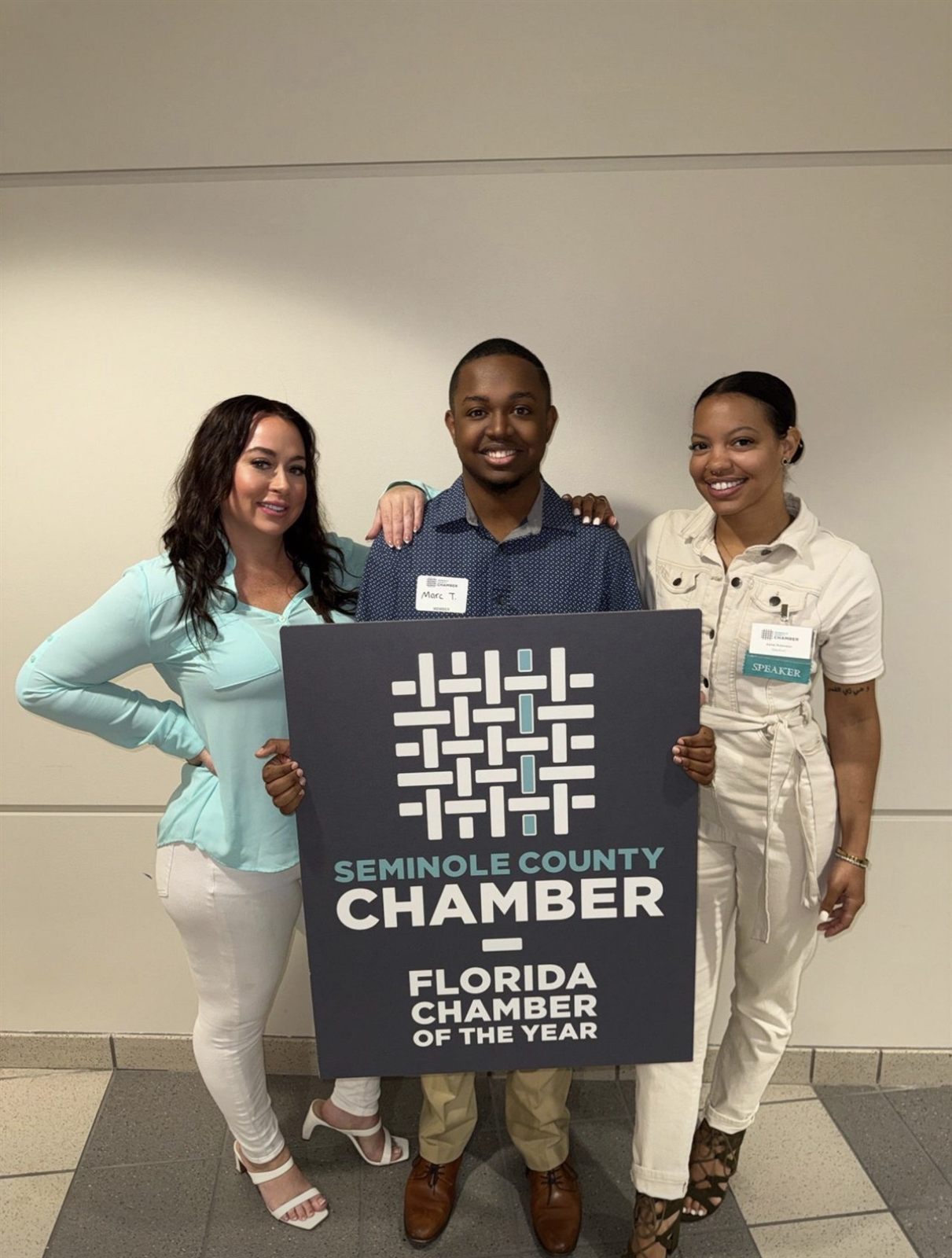 Marcai member holding the Seminole County Chamber Florida Chamber of the Year award.