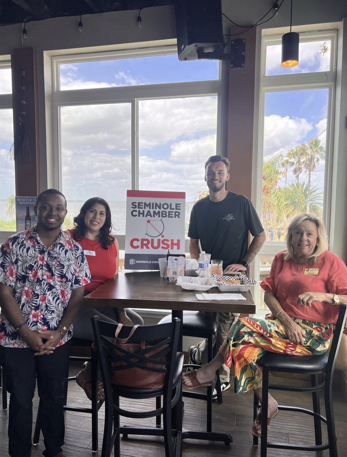 Marcai networking with members at a Seminole Chamber waterfront event.
